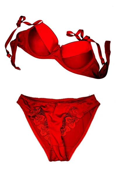Um sutiã vermelho e calcinha close-up no fundo branco . — Fotografia de Stock
