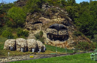 Roaring sculpture of a lion on a rocky hill, Vank, Nagorno-Karabakh Republic. Inscription in Russian says: 