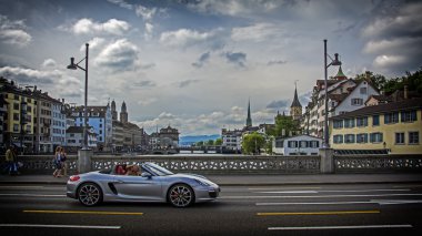 Zurich, Switzerland - June 14, 2015: sport car on bridge in old city. Porsche 911 Carrera Cabriolet