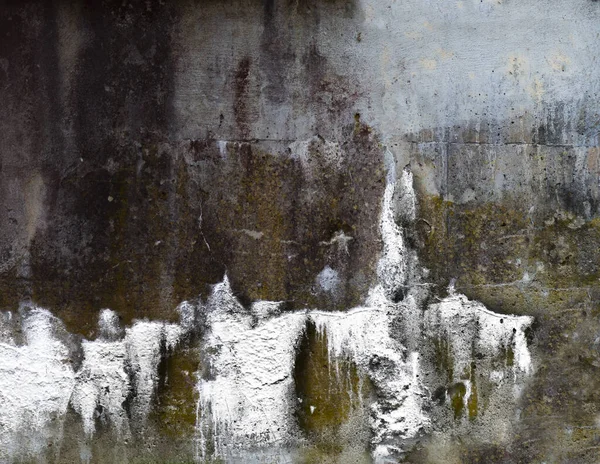 White paint on grunge weathered concrete wall, resembling angels
