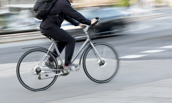 Man on silver colored bike — Stok Foto