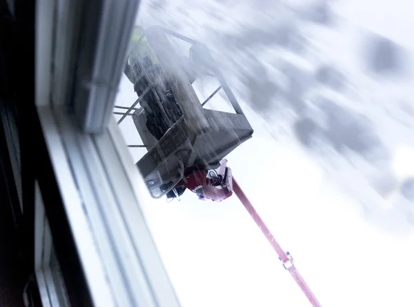 Clearing snow on roof — Stock Photo, Image