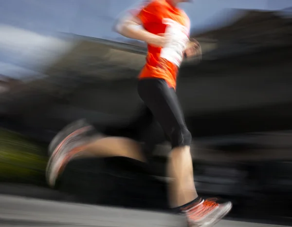 Running man in orange — Stock Photo, Image