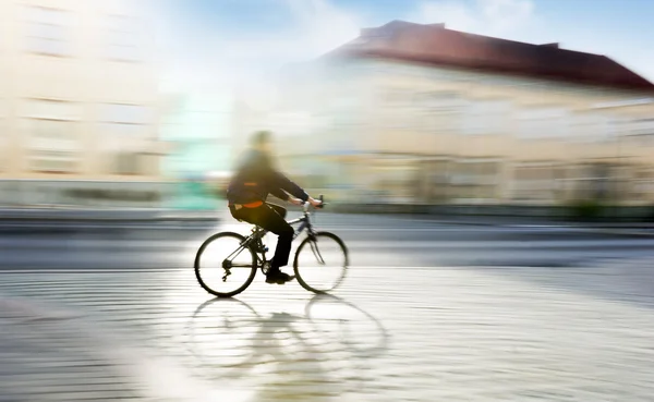 Man on bike in blurred motion — Stock Photo, Image