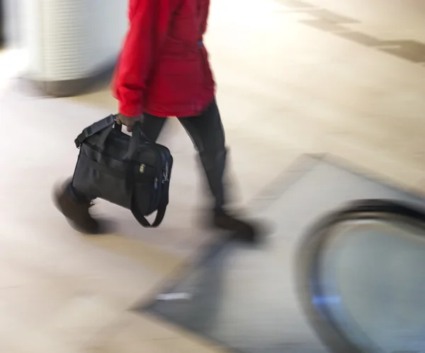 Person heading for escalators — Stock Photo, Image