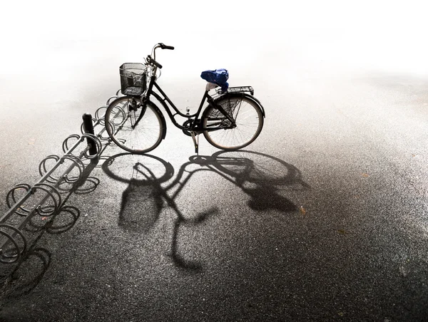 Bike parked in bicycle rack — Stock Photo, Image