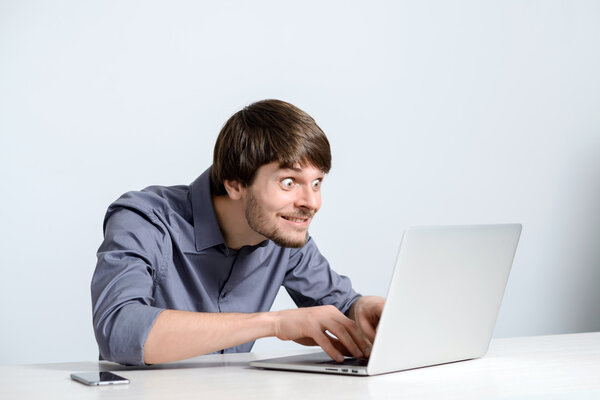 Young man working at laptop