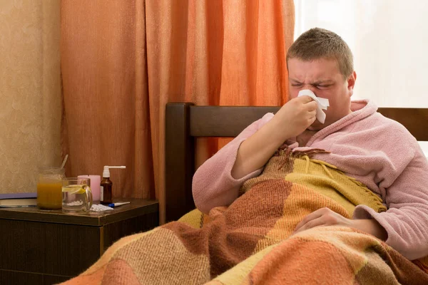 Sick Guy Bathrobe Lying Bed Blowing — Stock Photo, Image