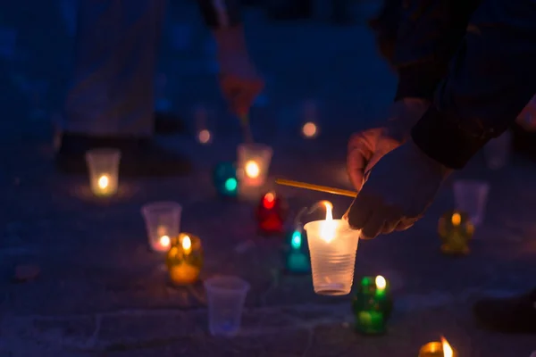 Man Lights Candle Standing Asphalt Day Remembrance Bereaved — Stock Photo, Image