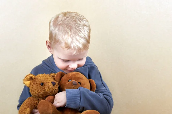 Three Year Old Boy Hugs Two Teddy Bears Tightly — Stock Photo, Image
