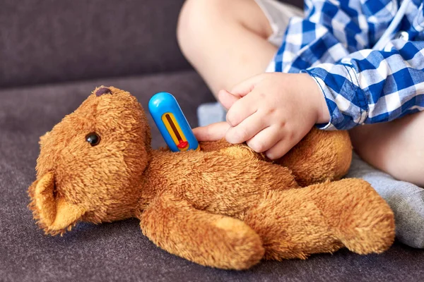 Little Boy Measures Temperature Teddy Bear Toy Thermometer Children Games — Stock Photo, Image