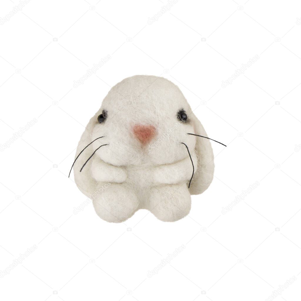 Handmade bunny felted of wool isolated on white background.