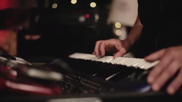 Hands of musician woman when playing the synthesizer — Stock Video