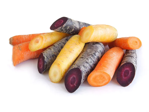 Raíces naranjas, amarillas y púrpuras de zanahoria vegetal —  Fotos de Stock