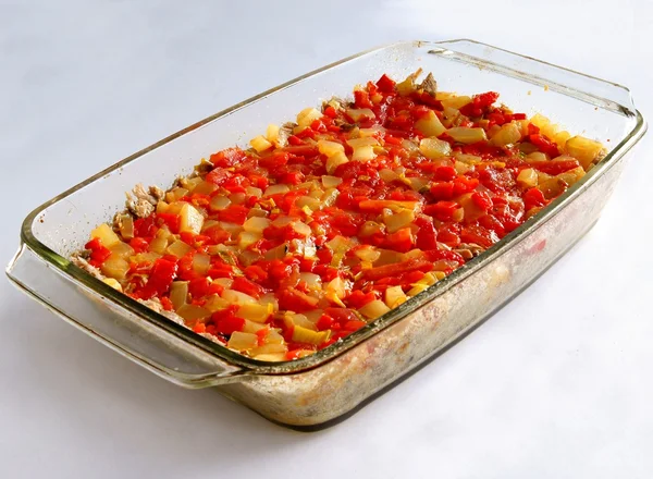 Peppes,tomatoes on dough as au gratin before roasting — Stock Photo, Image