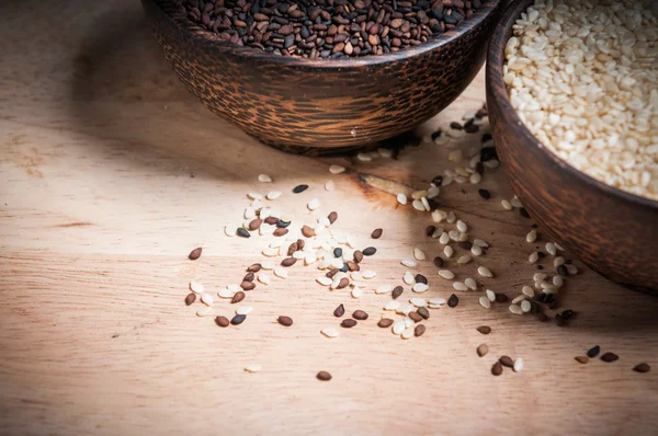 Sesame and poppy in wood bowl closeup — Stock Photo, Image