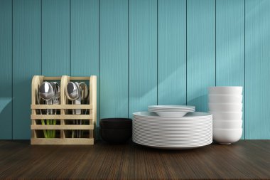 kaşık ve beyaz tabak üzerinde ahşap masa mutfak aksesuarları