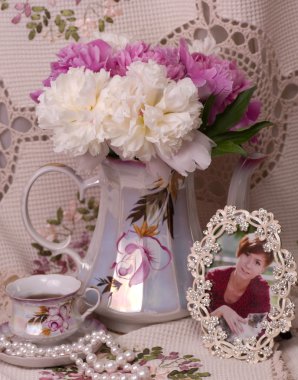teacup and frame with spring peonies clipart
