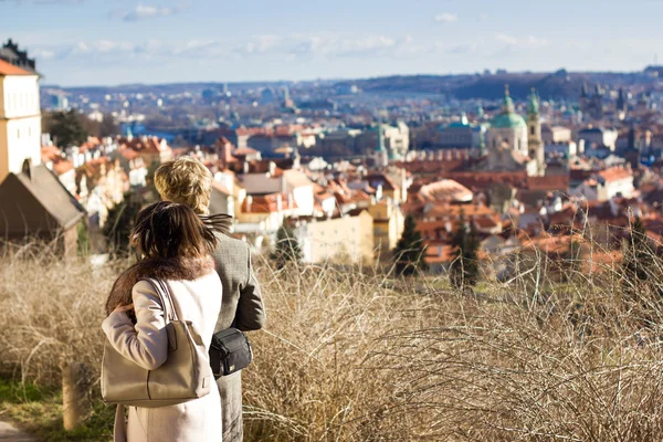 Young couple observing view of Prague — Stock Photo, Image