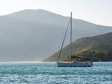 sail boats in a greek island clipart