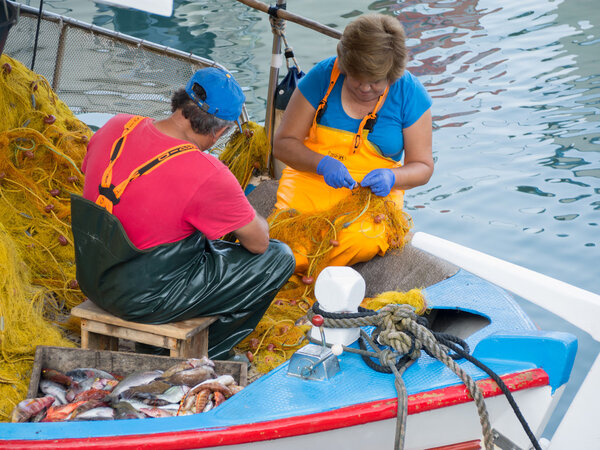 a couple of fishers in Greece