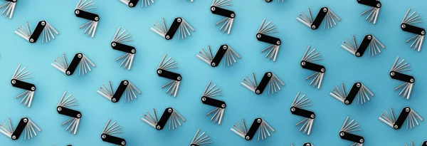 Pattern of bicycle repair tools on blue background.