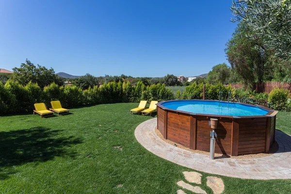 Above ground pool sets on a concrete pad . — Stock Fotó