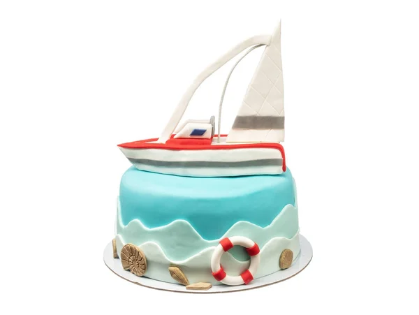 A marine-themed cake, a sugar paste sailboat for a boys birthday. On a white isolated background. — Stock Photo, Image