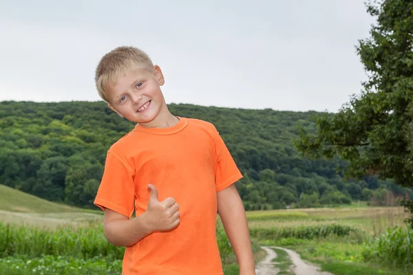 Cute gay boy in the forest shows all ok. — Stock Photo, Image