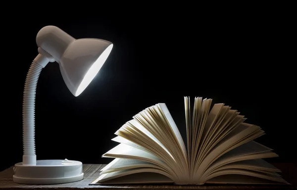 Lamp night light on the book. For reading. In library. — Stock Photo, Image