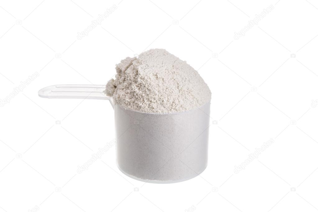Measuring spoon for milk whey protein. On a white background.