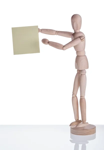 Wooden mannequin shows sticker. Frame for text. — Stock Photo, Image