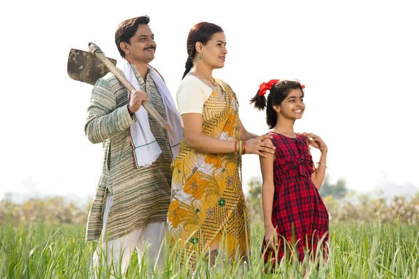 Happy Indian family in agricultural field — Stock Photo, Image