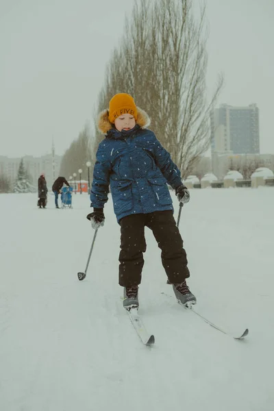 The boy is skiing. Winter sports. Skiing. The winter vacation. Weekend in winter. Winter activities