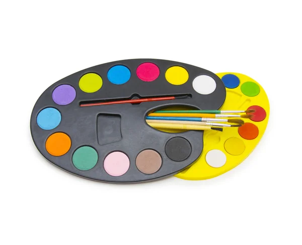 Pallette with brushes on a white background — Stock Photo, Image