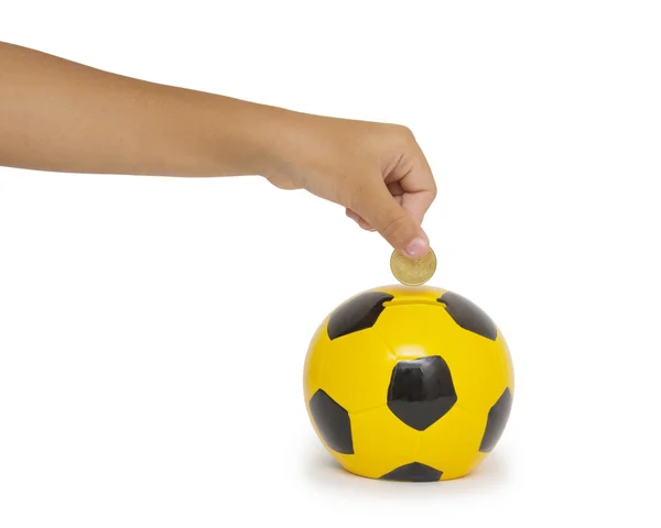 Hand putting coin into a moneybox — Stock Photo, Image