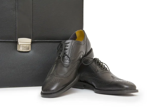 Schoenen en zak op witte achtergrond — Stockfoto