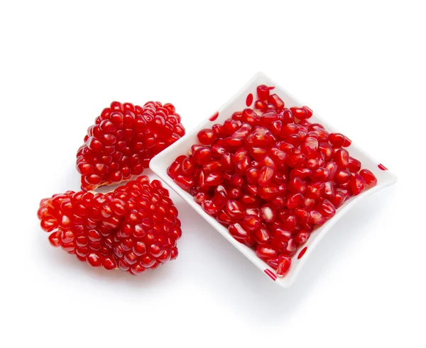 Loose pomegranate seeds in a white bowl — Stock Photo, Image