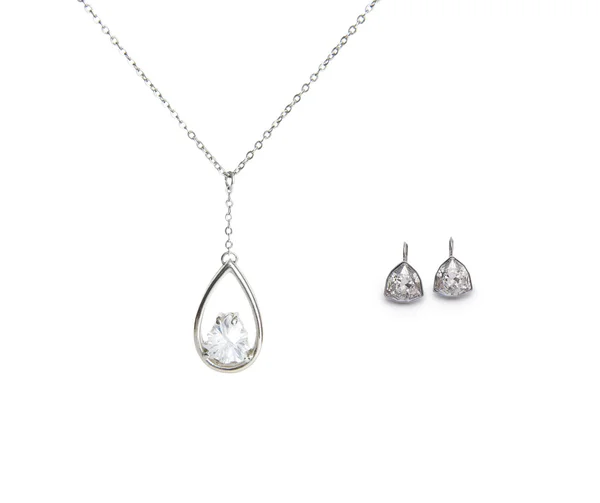 Belo colar de prata e brincos de diamante isolado em branco Fotos De Bancos De Imagens
