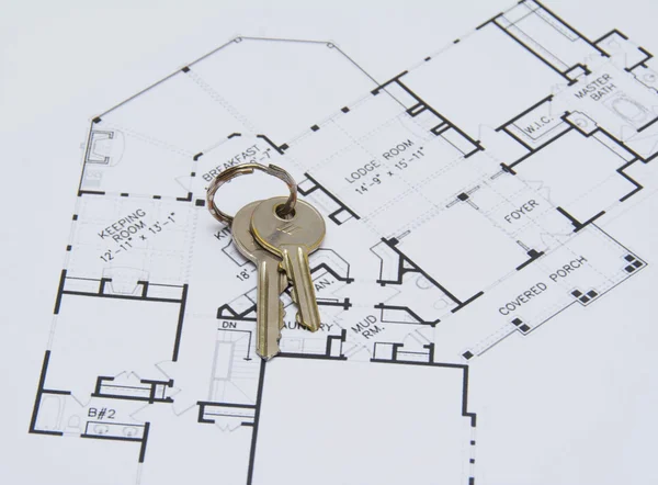 Key on house plan — Stock Photo, Image