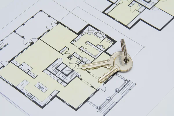 Key on house plan close-up — Stock Photo, Image