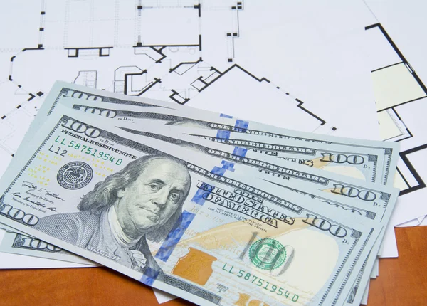 Money on house plan close-up — Stock Photo, Image