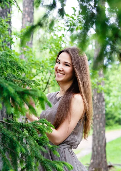 Young, beautiful, sexy woman in park on walk — Stock Photo, Image