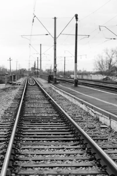 Rails, cross ties, columns, wires — Stock Photo, Image