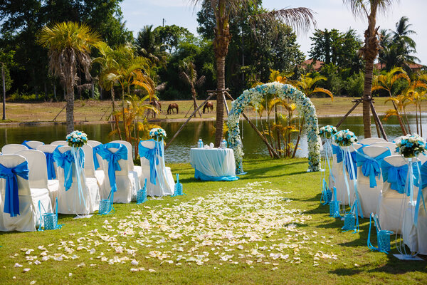 wedding ceremony flowers, arch, chairs