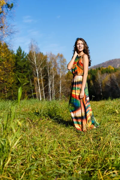 Happy young woman in the autumn wood of the mountain — Stock Photo, Image