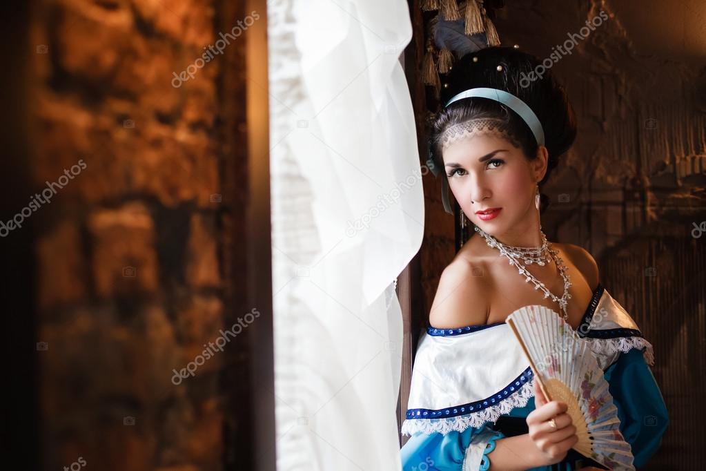 girl in an interior in an ancient dress