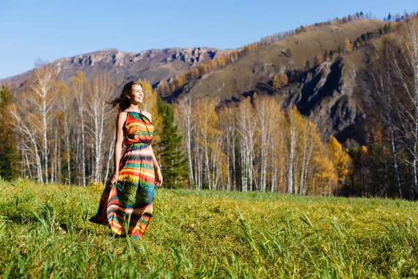 Happy young woman in the autumn wood of the mountain — Stock Photo, Image