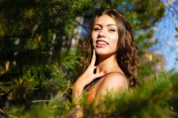 Happy young woman in the autumn wood of the mountain — Stock Photo, Image