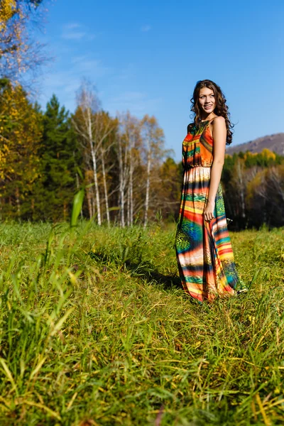 Happy young woman in the autumn wood of the mountain — Stock Photo, Image